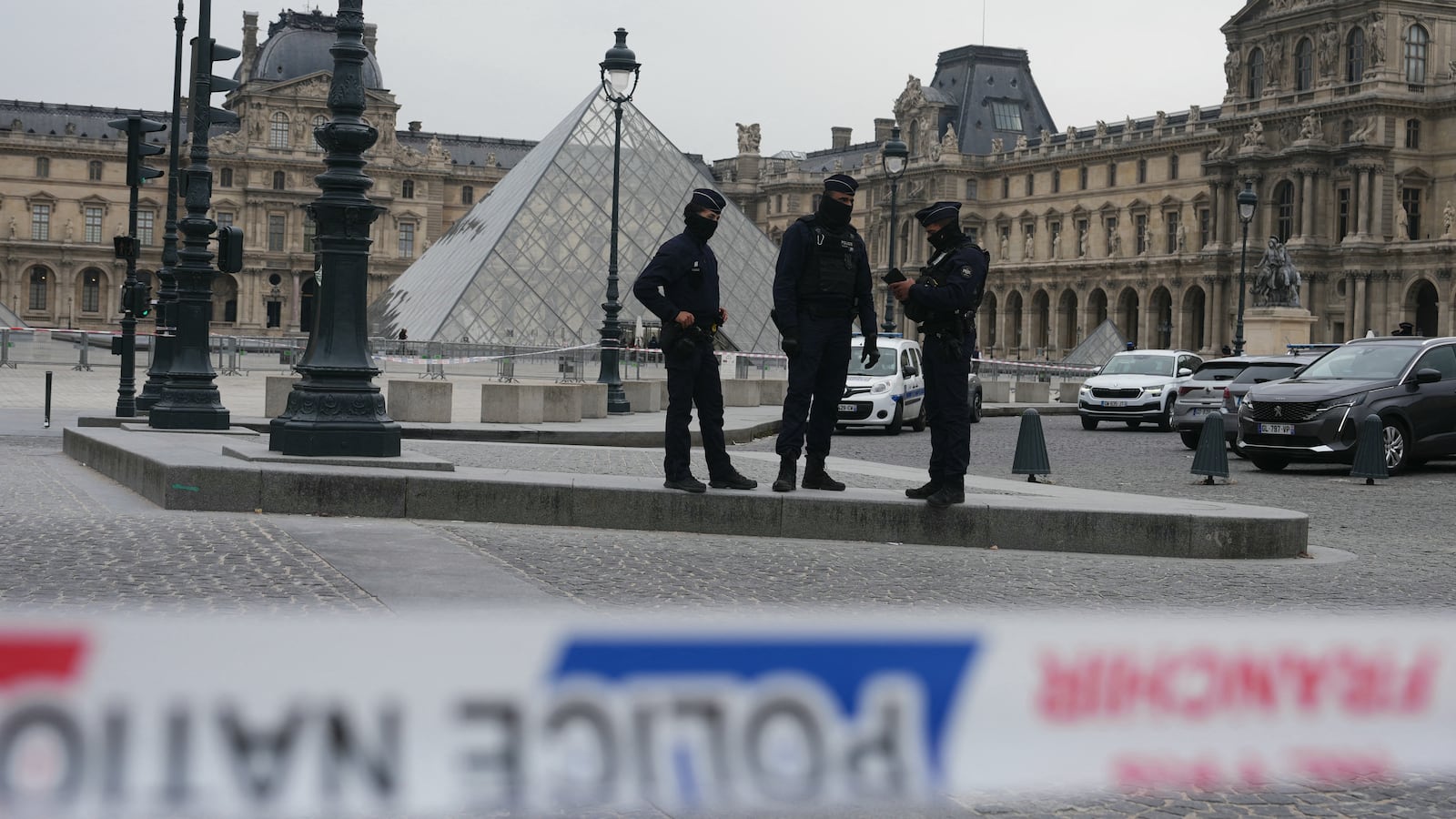 French police officers patrol in front of the Louvre Museum in Paris after it was robbed on October 19, 2025.