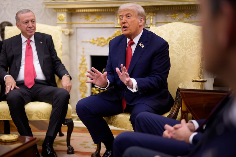 President Donald Trump, seated next to Turkish President Recep Tayyip Erdogan, announced that he wanted to use tariff money to bail out "hurting" farmers.