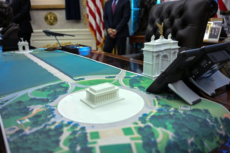 A plan for an arch across from the Lincoln Memorial is seen on the Resolute Desk as US President Donald Trump meets with Finnish President Alexander Stubb and Prime Minister Petteri Orpo in the Oval Office of the White House in Washington, DC, on Oct. 9, 2025.