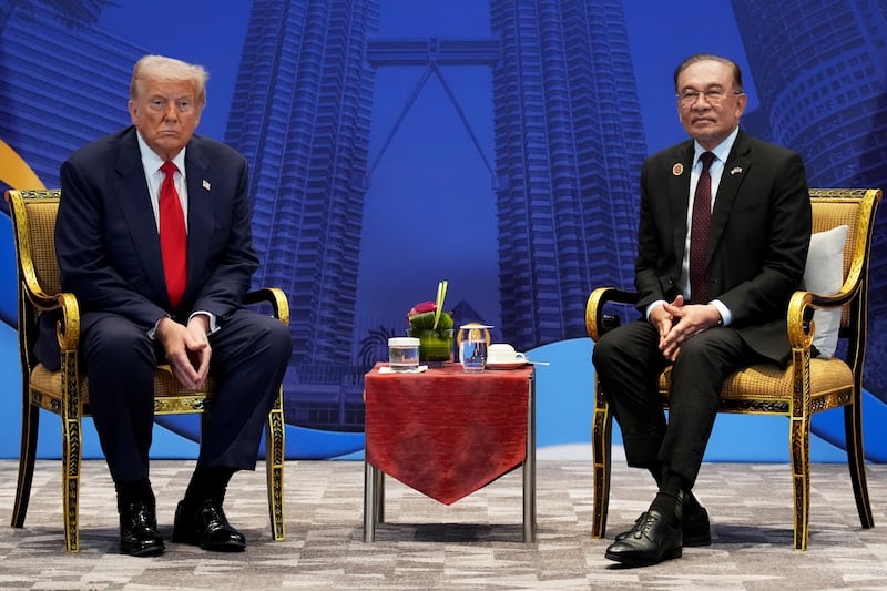 President Donald Trump and Malaysian Prime Minister Anwar Ibrahim attend a meeting in Kuala Lumpur.