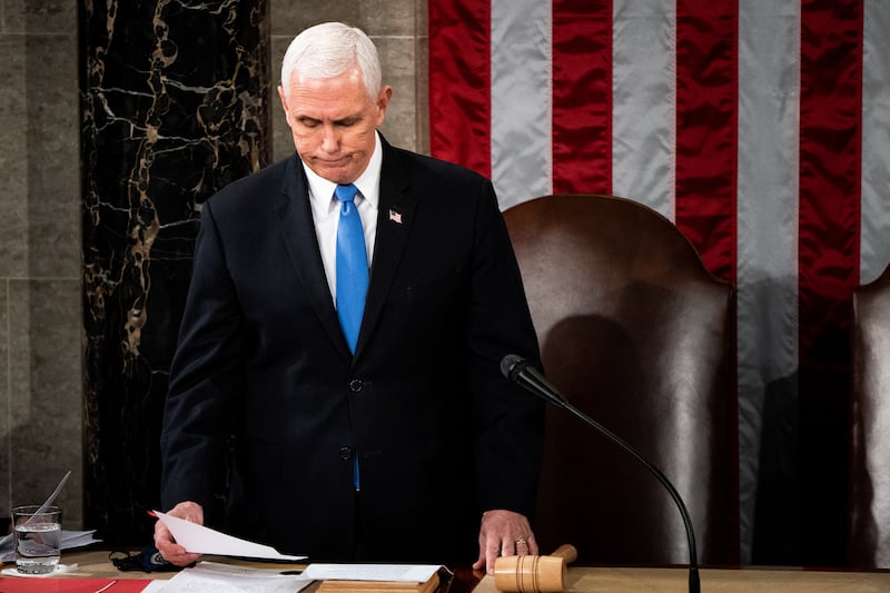 WASHINGTON, DC - JANUARY 06: U.S. Vice President Mike Pence presides over a joint session of Congress to certify the 2020 Electoral College results on January 6, 2021 in Washington, DC. Congress held a joint session today to ratify President-elect Joe Biden's 306-232 Electoral College win over President Donald Trump. A group of Republican senators said they would reject the Electoral College votes of several states unless Congress appointed a commission to audit the election results. (Photo by Erin Schaff-Pool/Getty Images)