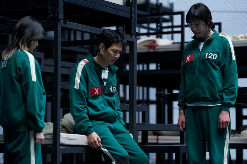 Jo Yu-ri as Jun-hee, Lee Jung-jae as Seong Gi-hun, and Park Sung-hoon as Hyun-ju.