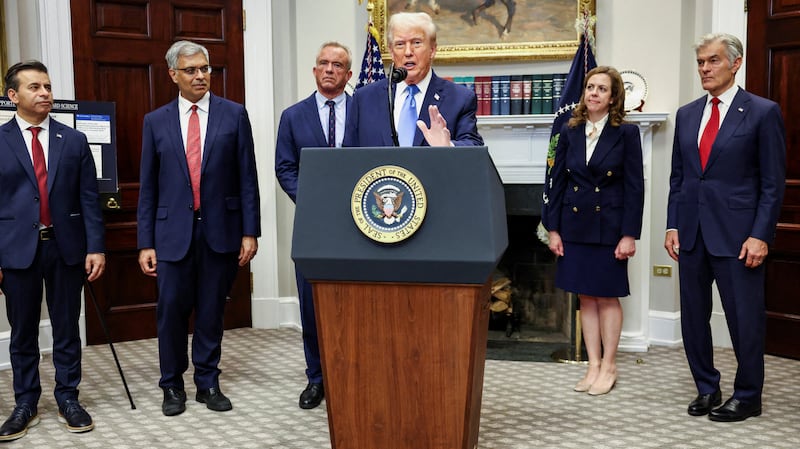 U.S. President Donald Trump, with Administrator of the Centers for Medicare and Medicaid Services Mehmet Oz, Dorothy Fink, acting U.S. assistant secretary for health, U.S. National Institutes of Health (NIH) Director Jay Bhattacharya, U.S. Food and Drug Administration (FDA) Commissioner Dr. Marty Makary, and U.S. Secretary of Health and Human Services Robert F. Kennedy Jr.