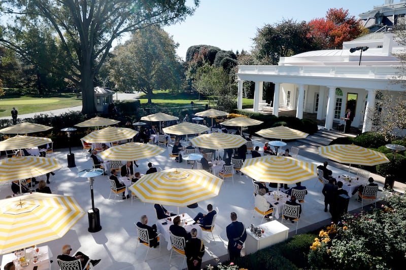 The Rose Garden this week—the yellow-and-white striped umbrellas are similar to those found at the poolside of Trump’s Florida resort.