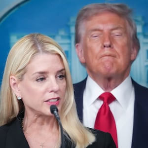 WASHINGTON, DC - AUGUST 11: Attorney General Pam Bondi delivers remarks as U.S. President Donald Trump looks on during a press conference in the James S. Brady Press Briefing Room of the White House August 11, 2025 in Washington, DC. Trump announced he will use his authority to place the DC Metropolitan Police Department under federal control to assist in crime prevention in the nation’s capital, and that the National Guard will be deployed to DC.  (Photo by Andrew Harnik/Getty Images)