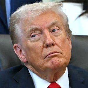 US President Donald Trump listens during an announcement in the Oval Office of the White House in Washington, DC, on October 16, 2025. (Photo by ANDREW CABALLERO-REYNOLDS / AFP) (Photo by ANDREW CABALLERO-REYNOLDS/AFP via Getty Images)
