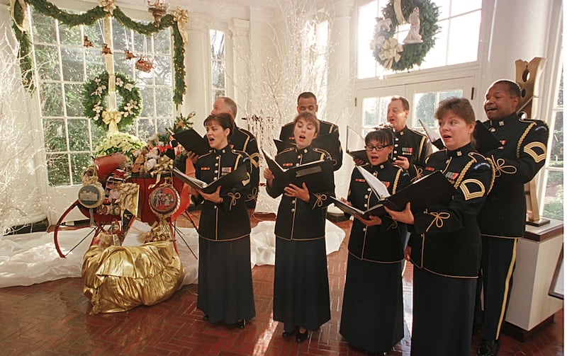 Members of the U.S. Army choir sing December 4, 2000 in the East Wing Landing.
