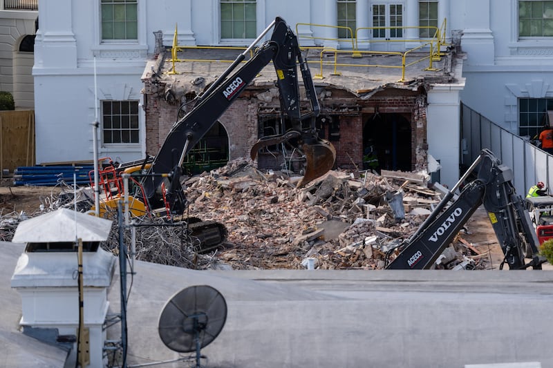 An excavator works to clear rubble after the East Wing of the White House was demolished on October 23, 2025 in Washington, DC. The demolition is part of U.S. President Donald Trump's plan to build a ballroom reportedly costing at least $250 million on the eastern side of the White House.