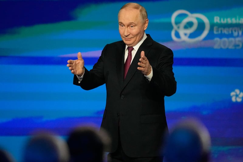 Russian President Vladimir Putin gestures during a plenary session of the Russian Energy Week forum in Moscow