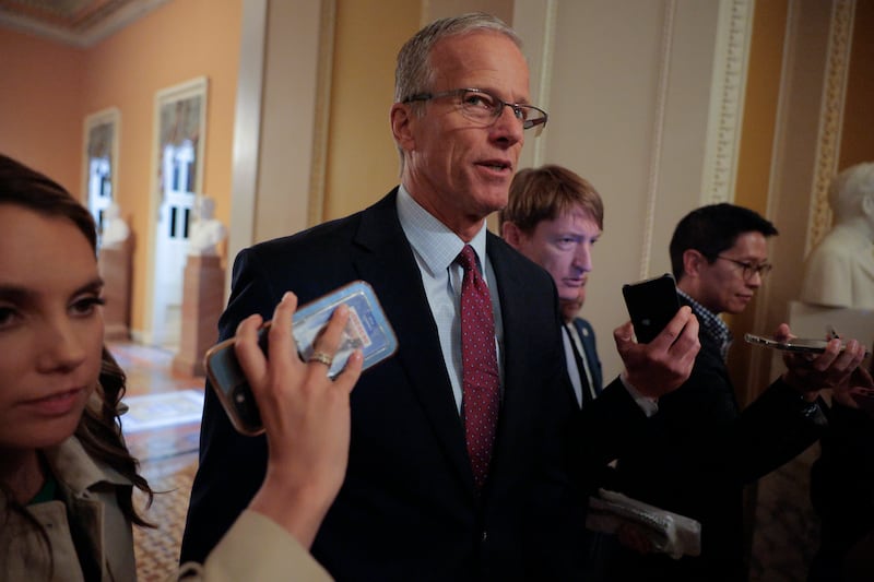 WASHINGTON, DC - AUGUST 01: Reporters surround Senate Majority Leader John Thune (R-SD) as he moves between his office and the Senate Chamber at the U.S. Capitol on August 01, 2025 in Washington, DC. Thune, Senate Minority Leader Charles Schumer (D-NY) and White House officials are negotiating a way forward with nominations and appropriations bills ahead of the Congressional August recess. (Photo by Chip Somodevilla/Getty Images)
