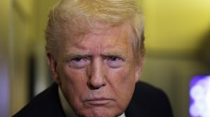 IN FLIGHT - OCTOBER 19: U.S. President Donald Trump speaks to members of the press on October 19, 2025 aboard Air Force One. The President is returning to Washington, DC, after spending his weekend at Mar-a-Lago resort in Palm Beach, Florida. (Photo by Alex Wong/Getty Images)