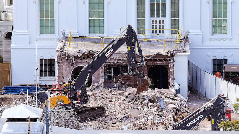 An excavator works to clear rubble after the East Wing of the White House was demolished on October 23, 2025 in Washington, DC.